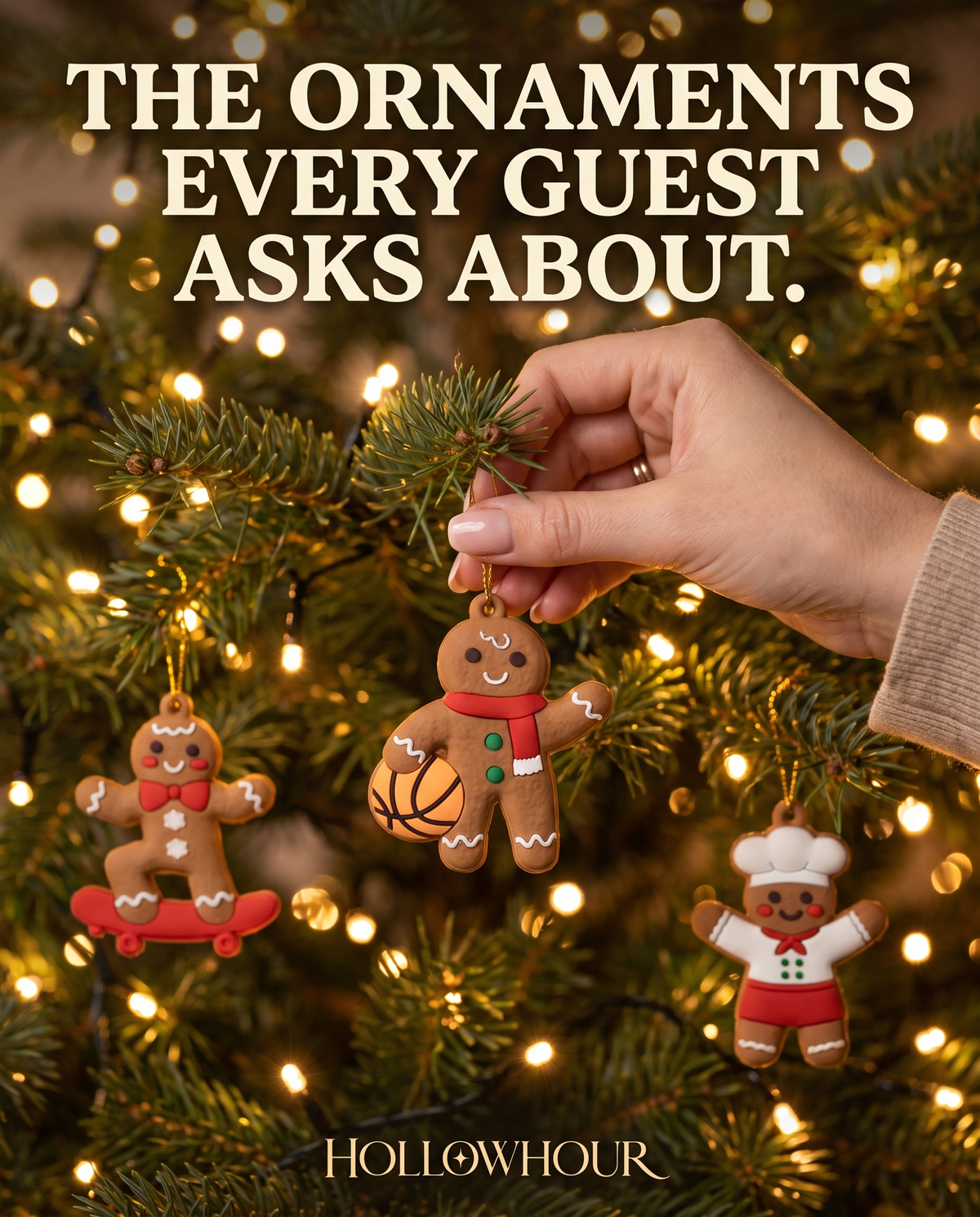 A hand hanging a gingerbread ornament on a glowing Christmas tree